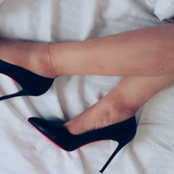 woman wearing black peep toe heeled shoes