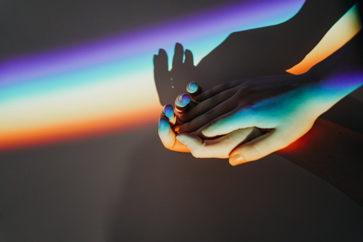 Persons Hands With Rainbow Colors