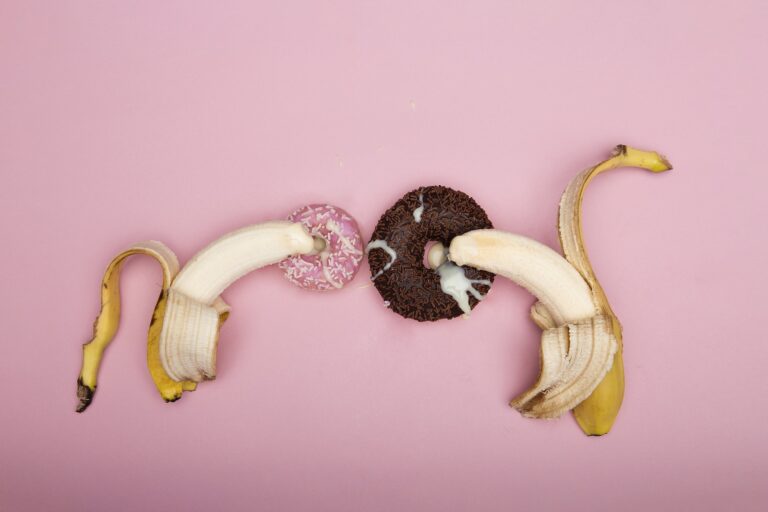 Peeled Banana on Pink Background