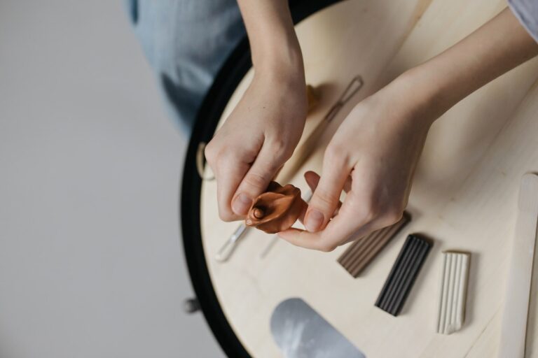 A Person Holding a Brown Clay