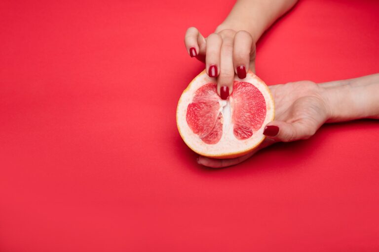 sliced lemon on persons hand