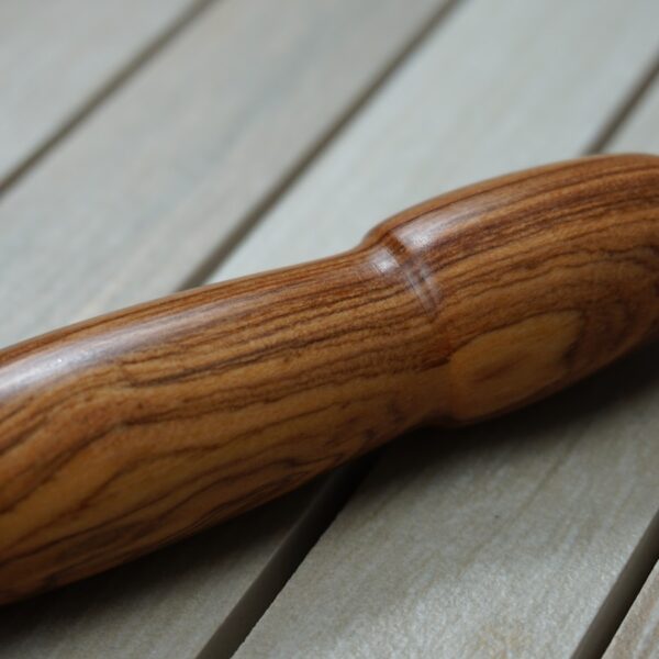brown wooden handle on white wooden table