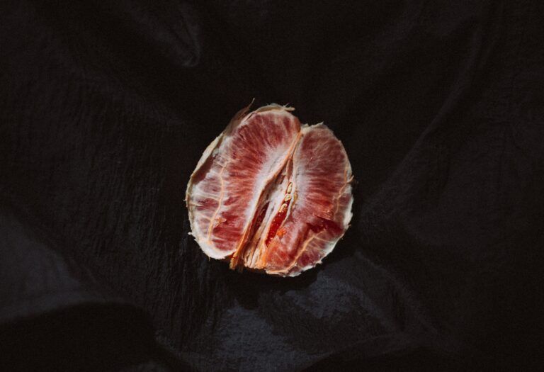 round red fruit on black textile