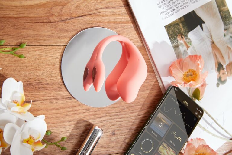 a pink object sitting on top of a wooden table